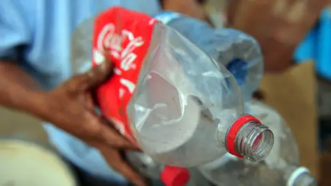 Getty Images Plastic coke bottles