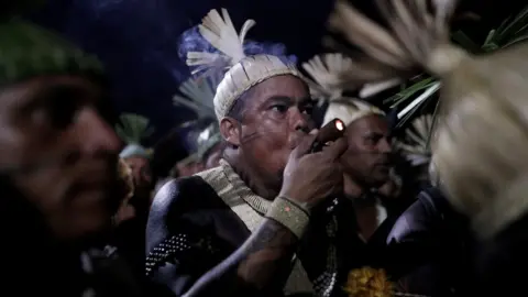 Reuters Indigenous men take part in a protest to defend indigenous land and cultural rights