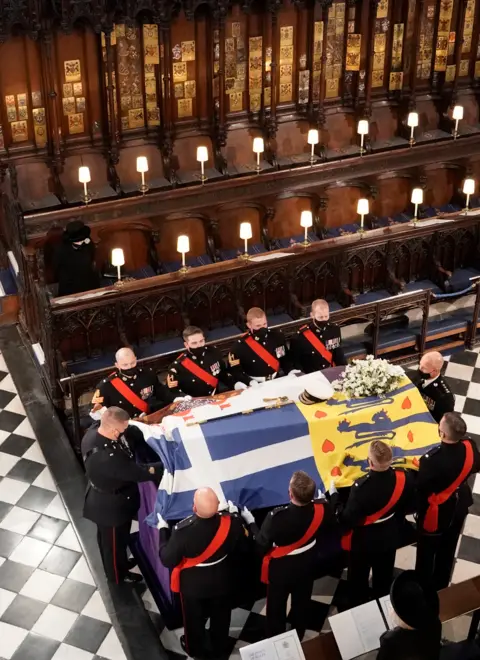 PA Media The coffin is carried into St George's Chapel during the funeral of Britain's Prince Philip, who died at the age of 99, at Windsor Castle, Britain, April 17, 2021.