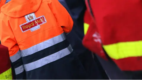 PA Media A Royal Mail orange jacket