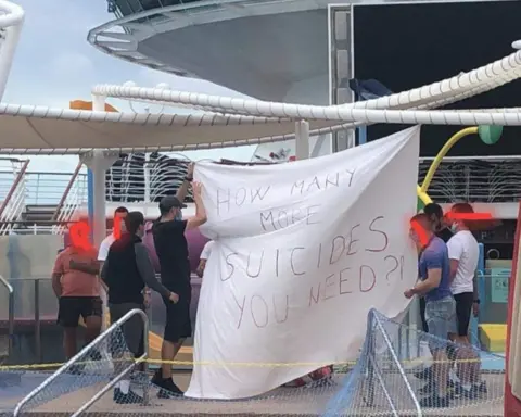 Jim Walker Protesters put up a banner on the Majesty of the Seas cruise ship