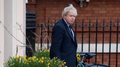 PA Boris Johnson leaves his house, 22 March