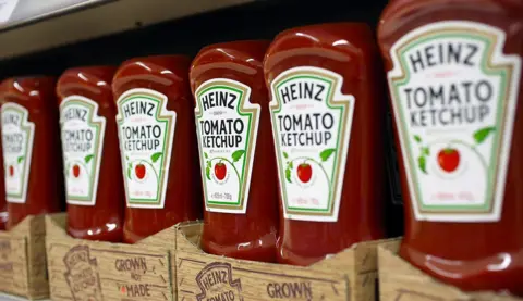 Getty Images Heinz Ketchup bottles on a supermarket shelf