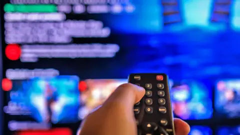 Getty Images A person watches Netflix on their TV