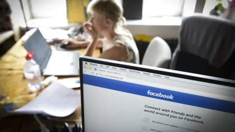 Getty Images Computer showing Facebook,