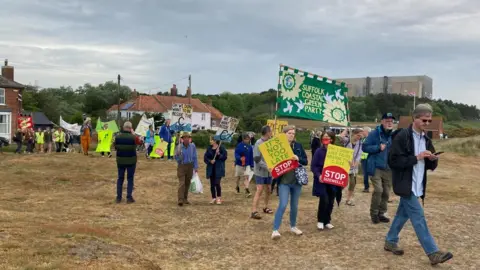 Jenny Kirk/BBC Anti-nuclear protesters on Sizewell beach