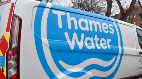 Getty Images The side of a white Thames Water van, with the company's logo painted on it in blue and white
