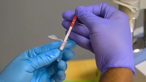 Getty Images A researcher tests a heroin sample for xylazine