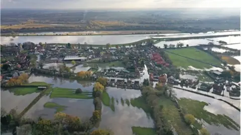 PA Media The flood water at Fishlake, in Doncaster, South Yorkshire