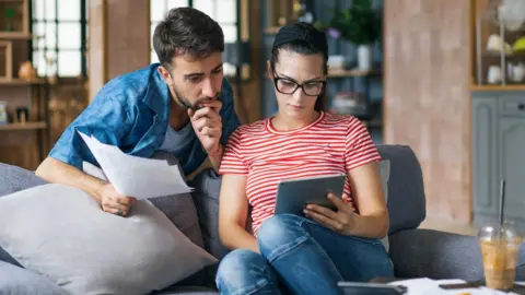 Getty Images Couple looking at tablet