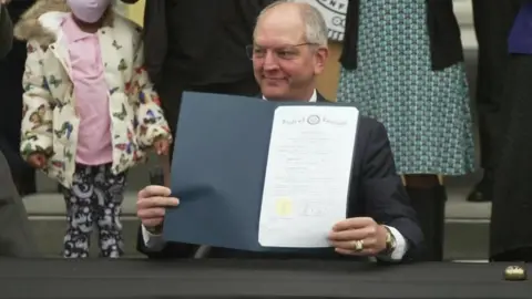 CBS Governor Bel Edwards signed the pardon near the site of Plessy's arrest