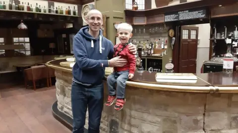 Vicky Flintoft Emmerdale star James Hooton, who plays Sam Dingle, with Archie