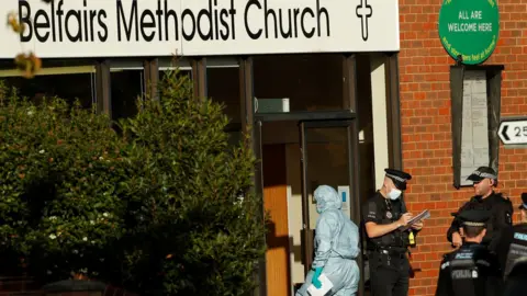 Reuters Police and forensics officers outside Belfairs Methodist Church
