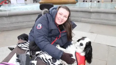 Lucy Watts Lucy Watts with her support dog Molly