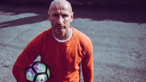 Gareth Thomas carrying a football