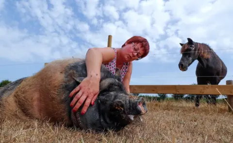 Reuters Valerie Luycx is seen with Pastis a 10-year-old Vietnamese pig