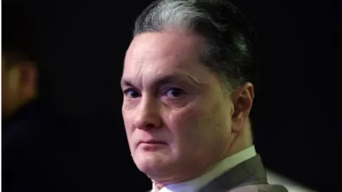 Getty Images Gautam Hari Singhania, Chairman & Managing Director of the Raymond Group looks on during an event in Mumbai on November 16, 2017. Raymond Group, the leading manufacturer, marketer and retailer of worsted suiting fabrics and ready-to-wear apparel launched a new range of fine fragrances. / AFP PHOTO / INDRANIL MUKHERJEE (Photo credit should read INDRANIL MUKHERJEE/AFP via Getty Images)