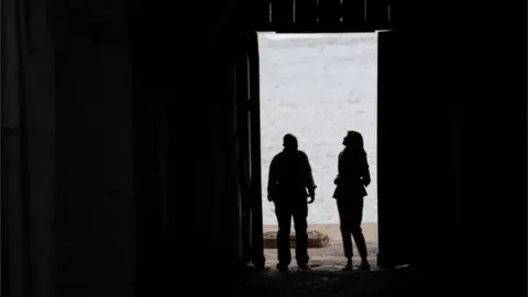 AFP US First Lady Melania Trump stands with Kwesi Essel-Blankson, Museum Educator, at the Cape Coast Castle, a former slave trading fort, in Cape Coast, on October 3, 2018