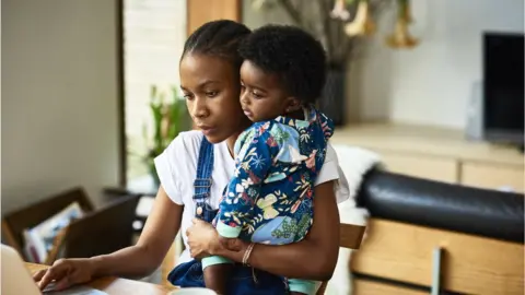 Getty Images A working mother