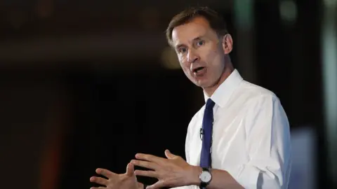 Getty Images Jeremy Hunt addresses the conference in Nottingham