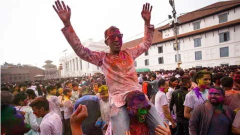 Getty Images Nepalese people celebrate Holi in Kathmandu