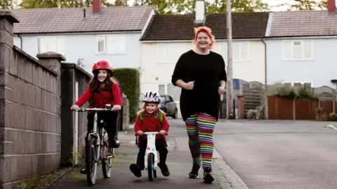 Bristol City Council Laura, a mum of two, walking to school with her children