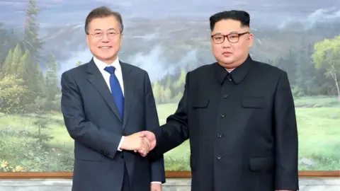 Reuters Moon Jae-in and Kim Jong-un