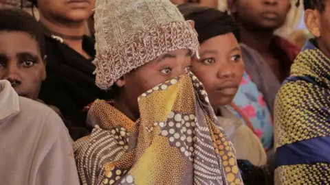 Reuters People attend a mass funeral for the victims of Storm Freddy in Blantyre, Malawi March 15, 2023