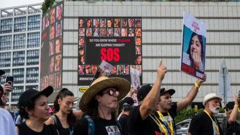 Getty Images Crowds march in Tel Aviv