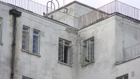 Grubby exterior of Epsom and St Helier Hospital