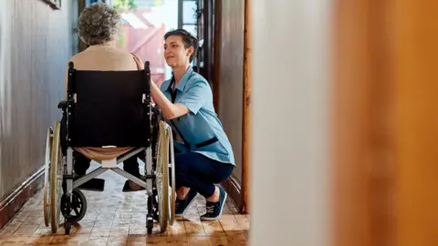 Dean Mitchell/Getty Images Carer