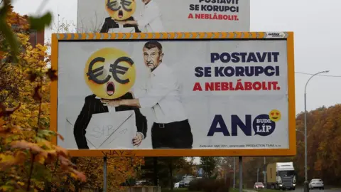 Reuters Cars drive past election campaign posters of the leader of ANO party Andrej Babis in Prague. The poster reads: "Stand up against corruption and stop babbling"