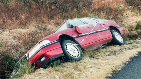 Getty Images Car in ditch