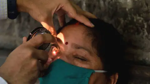 A woman having an eye examination at a hospital in Mumbai.