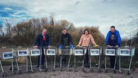 Lyndsey Downes Campaigners pictured with shopping trolleys