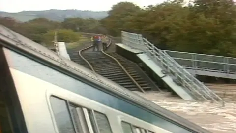 The Glarhyd bridge disaster, a train submerged in the River Towy