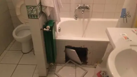 Zimbabwe rugby player A bathroom with tiles missing