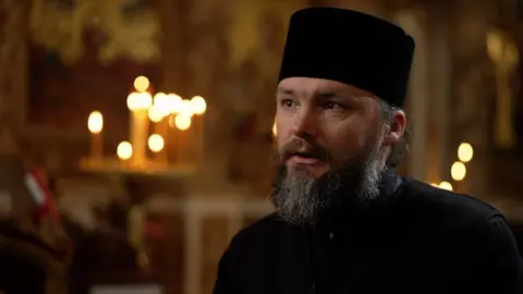 Archbishop Fedir standing in a church