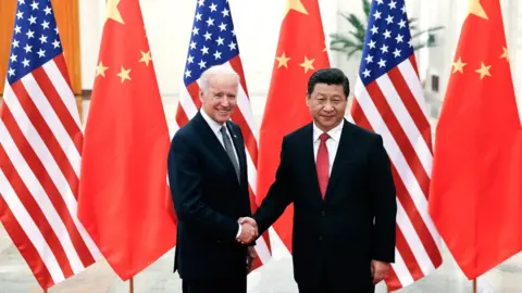 Getty Images BEIJING, CHINA - DECEMBER 04: Chinese President Xi Jinping (R) shake hands with U.S Vice President Joe Biden (L) inside the Great Hall of the People on December 4, 2013 in Beijing, China. U.S Vice President Joe Biden will pay an official visit to China from December 4 to 5. (Photo by Lintao Zhang/Getty Images)