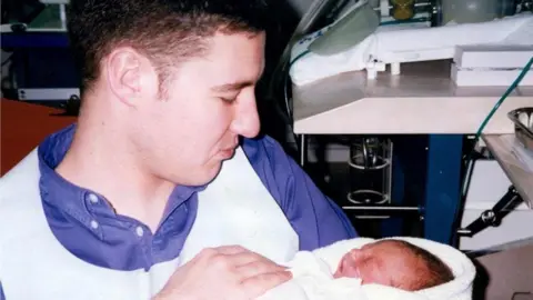 PA Alistair Wilson with one of his sons