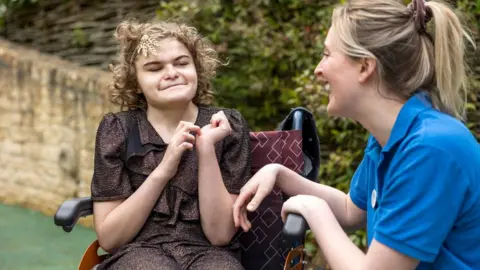 Millie Pilkington Josselin Tilley with Julia's House Team Nurse Molly Douglas