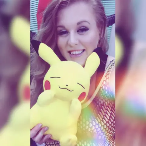 Kimberly Benson woman with pikachu toy