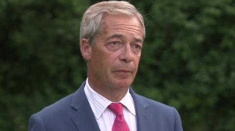 Nigel Farage being asked about offensive comments made by his campaigners