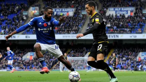 Getty Images Janoi Donacien battles with Oxford United's Nathan Holland