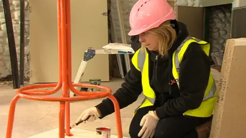 BBC Mr Smith's wife Tanya paints a chair