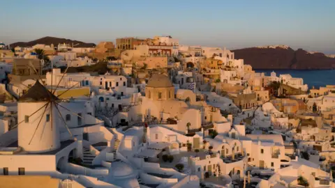 Getty Images A sun set on Santorini