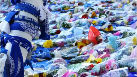 EPA/TIM KEETON Fans have been leaving tributes outside the King Power stadium