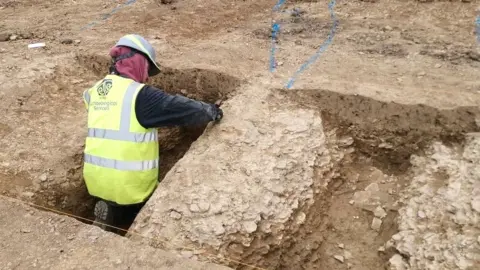 Archaeologist during a dig at Farm Lane, Fitzwilliam