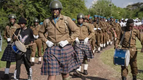 Ihsaan Haffejee/Getty Images People wearing similar clothes of soldiers during World War One, deliver various performance during the Diturupa Festival in Mabopane township of Gauteng, South Africa - Tuesday 2 January 2024