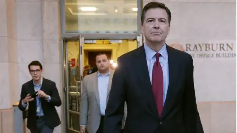 Getty Images Comey leaving Rayburn office building after testifying